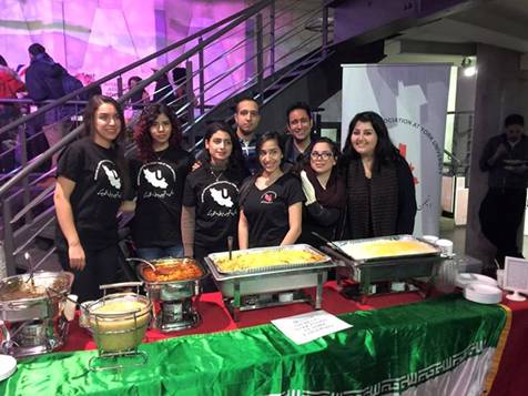 Image may contain: 8 people, people smiling, people standing and indoor