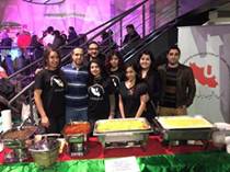 Image may contain: 8 people, people standing and food