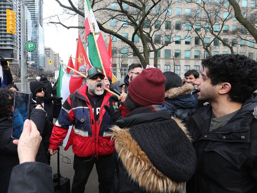 A small group of counterprotesters, some carrying American flags, attempted to antagonize the peace activists with their own chants and placards.